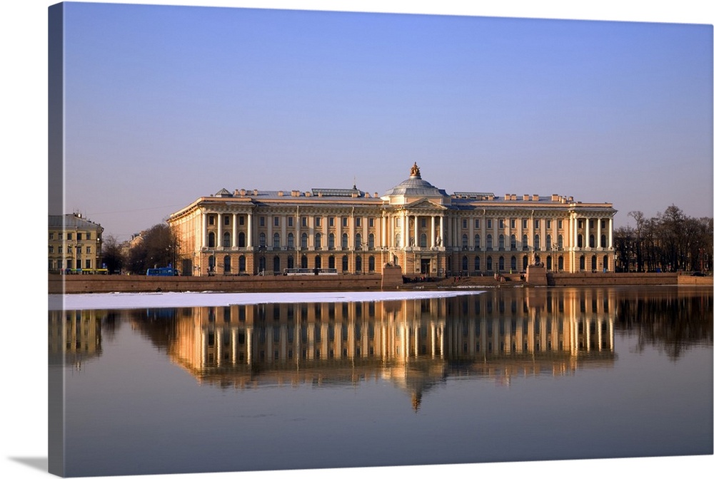 Russia, St.Petersburg, Along the Neva river embarkement, the St.Petersburg Art Academy with reflection in the water.