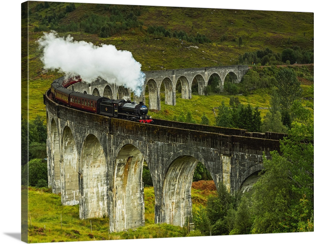 UK, Scotland, Highlands, Jacobite Steam Train crossing the Glenfinnan Viaduct.