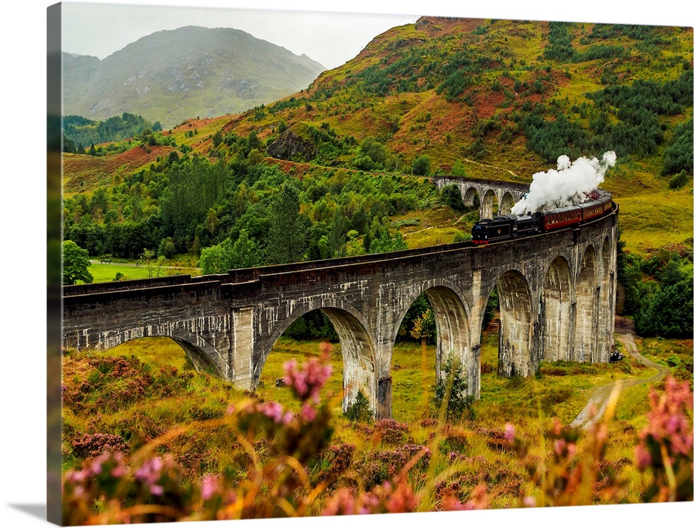 UK, Scotland, Highlands, Jacobite Steam Train crossing the Glenfinnan Viaduct.