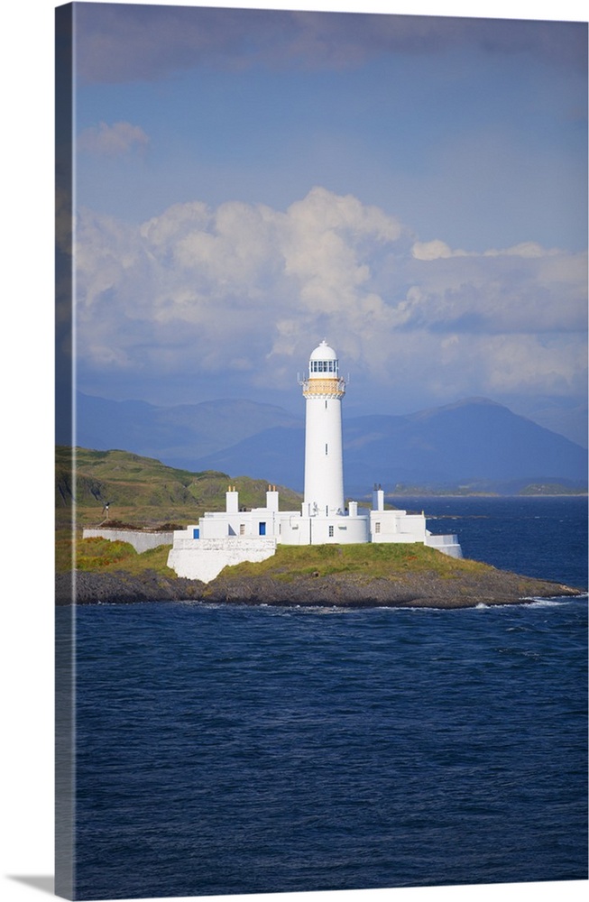 UK, Scotland, Inner Hebrides, Isle of Mull. A lighthouse guards the entrance to the island.