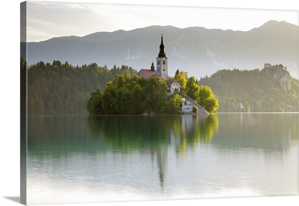 Slovenia, Julian Alps, Upper Carniola, Lake Bled. Morning mist on Lake Bled island and surroundings.