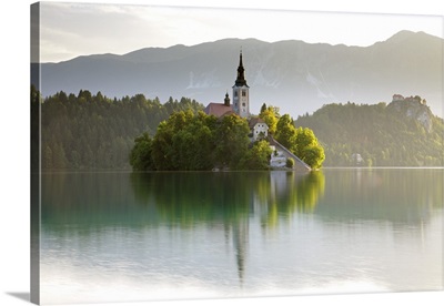 Slovenia, Julian Alps, Upper Carniola, Morning mist on Lake Bled island and surroundings