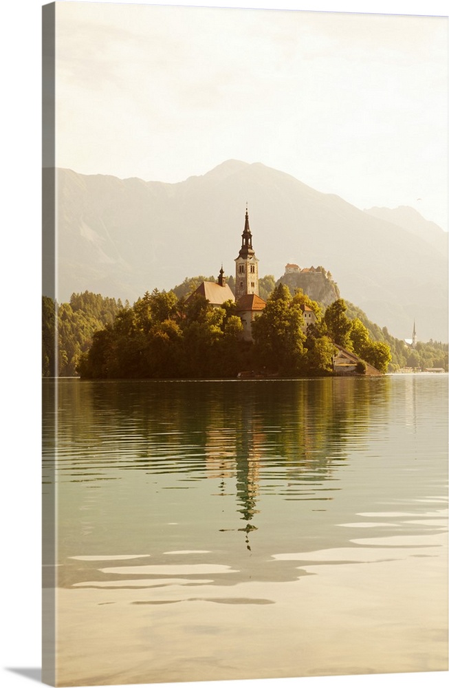 Slovenia, Julian Alps, Upper Carniola, Lake Bled. Morning mist on Lake Bled island and surroundings.