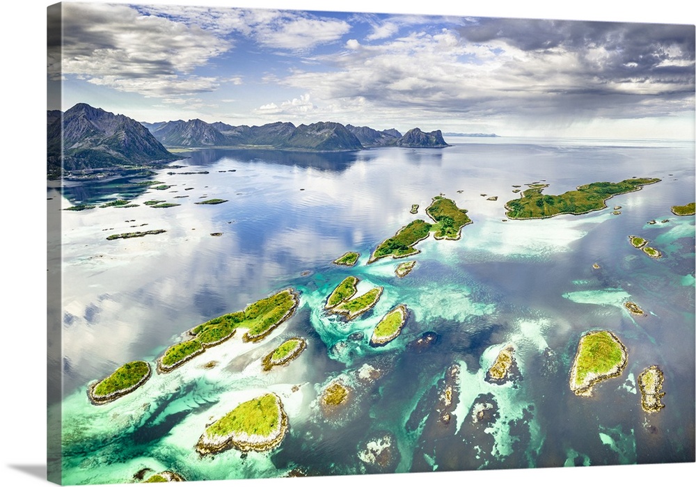 Small idyllic islands of Bergsoyan along the fjord, aerial view, Hamn I Senja, Skaland, Senja, Troms county, Norway.