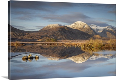 Snow Capped Mountain Reflections In Lochan Na H-Achlaise, Scotland, UK