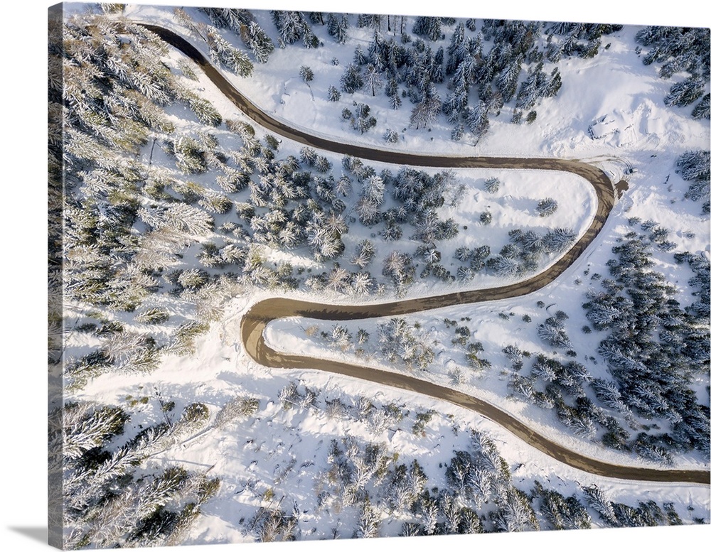 Snowy road aerial view, Passo Delle Erbe , Funes Valley, South Tyrol, Italy