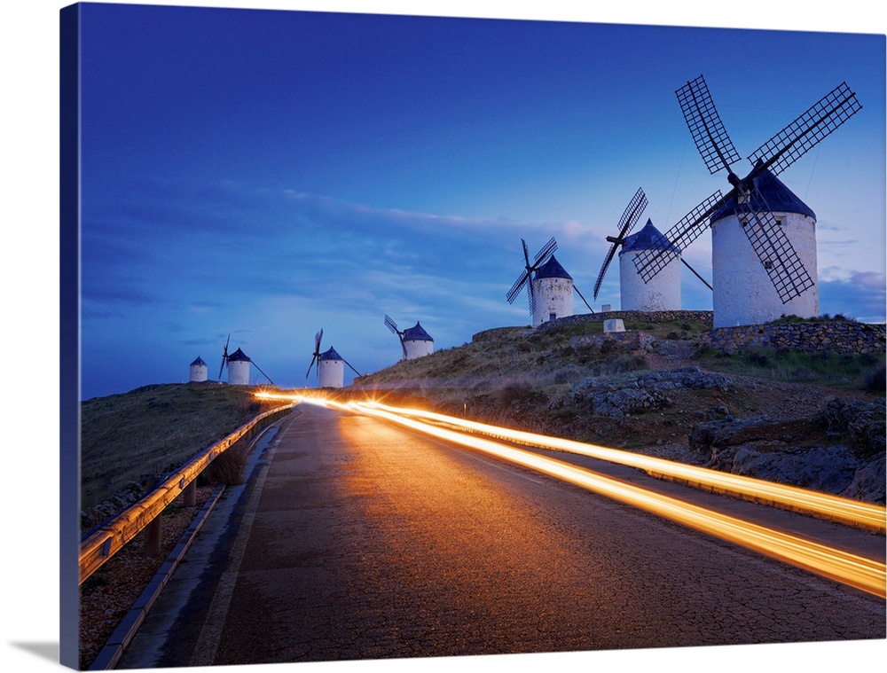 Spain, Castile, La Mancha, Consuegra, Windmills at dusk.