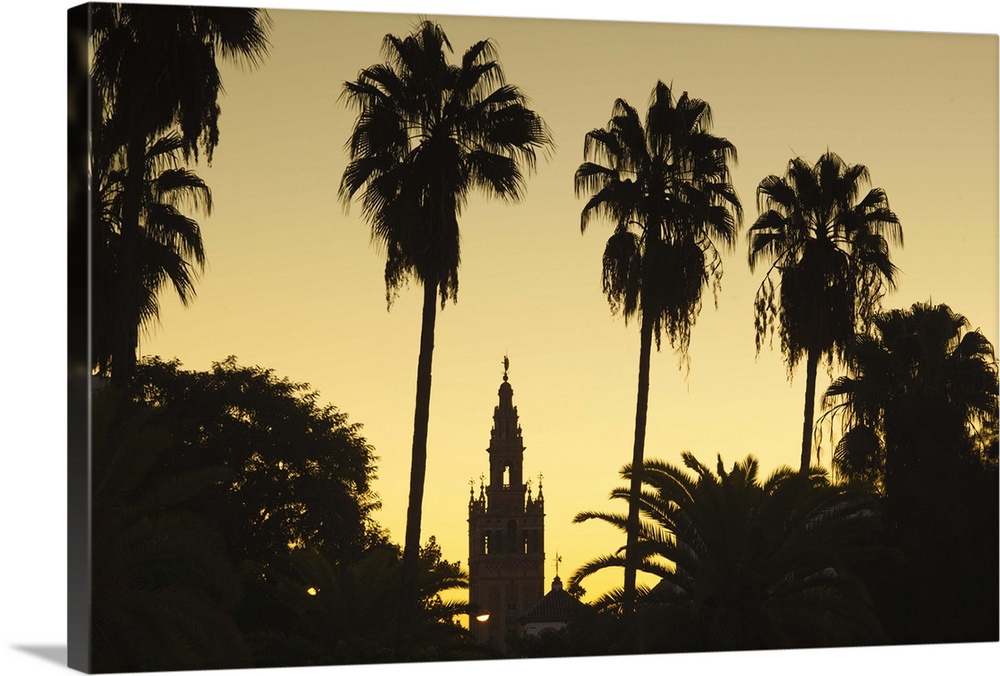 Spain, Andalucia Region, Seville Province, Seville, Giralda tower from the Rio Guadalquivir river, dawn
