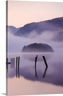 St Herbert's Island on Derwent Water at dawn on a misty morning, Cumbria