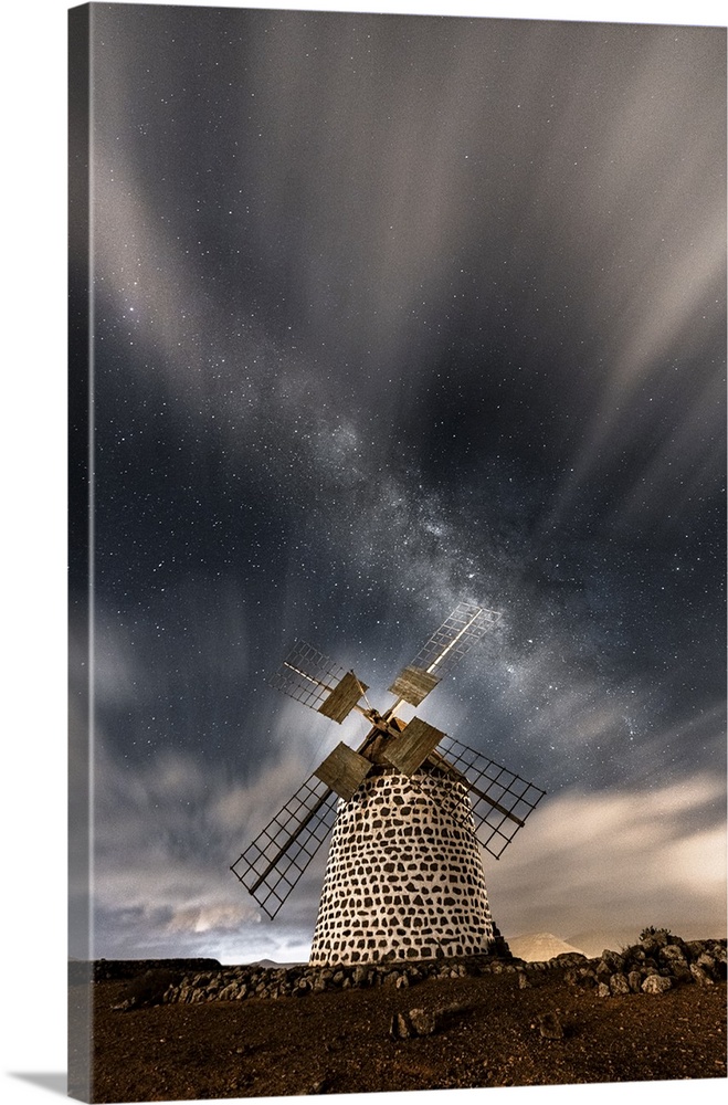 Starry sky above the stone windmill, La Oliva, Fuerteventura, Canary Islands, Spain.