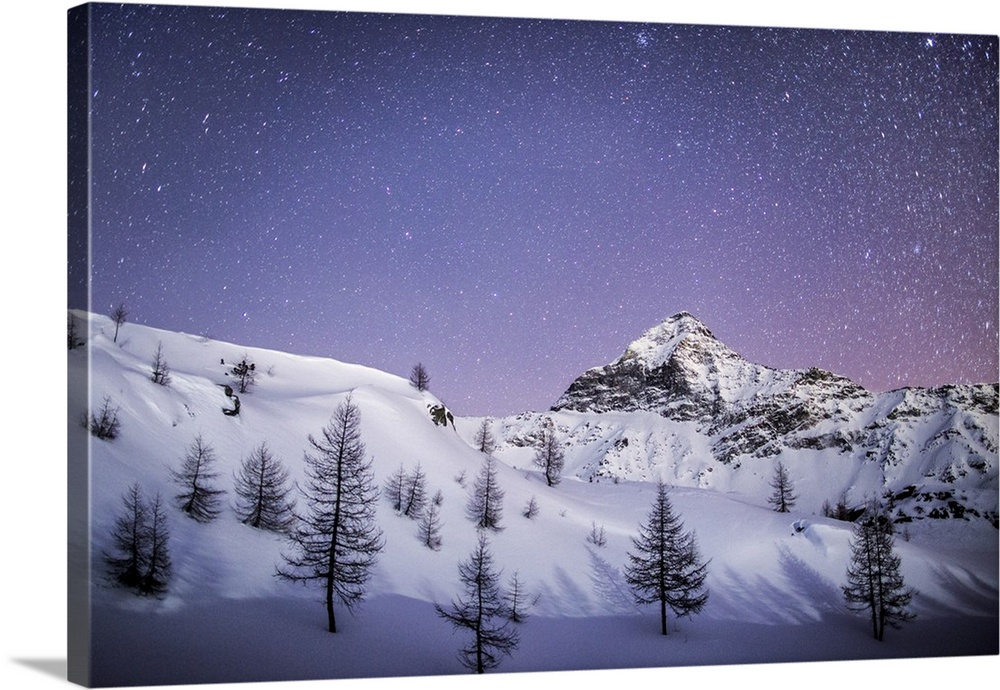 Amazing starry sky over the Scalino peak seen from Prabello alp., Valmalenco, Sondrio, Lombardy, Italy.