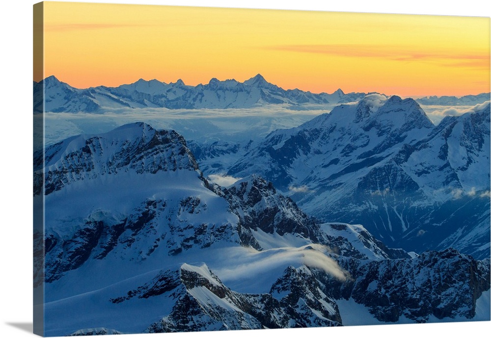 Sunrise view over the Alps from the top of Monte Rosa, Aosta Valley, Italy.