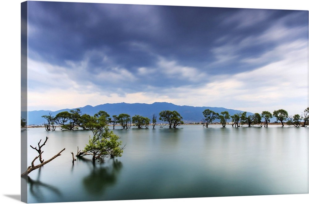 Sunset over one of the many lakes in the village of Heqing in Yunnan, China.