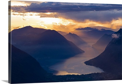 Sunset over the mountains and the lake Lugano, Switzerland