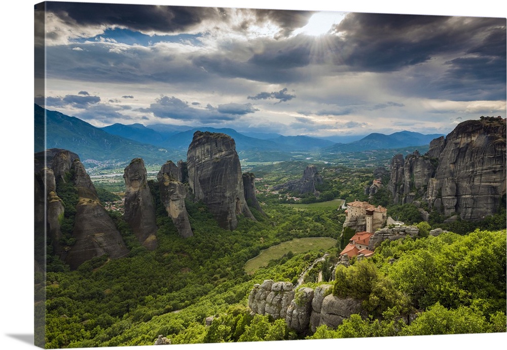 Sunset view over Monastery of Moni Agias Varvaras Roussanou and the spectacular massive rocky pinnacles of Meteora, Thessa...