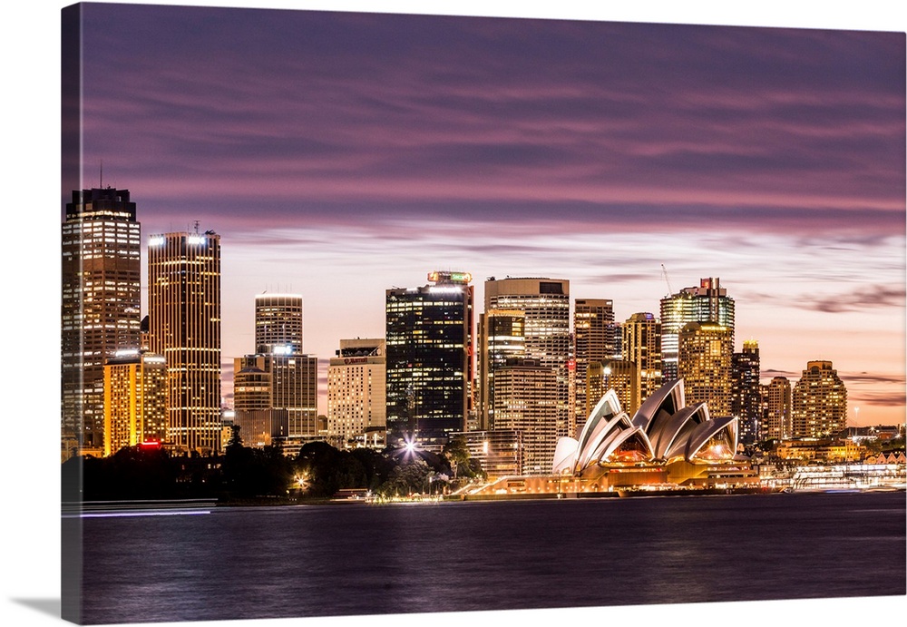 Sydney at dusk. Opera house and cityscape skyline.