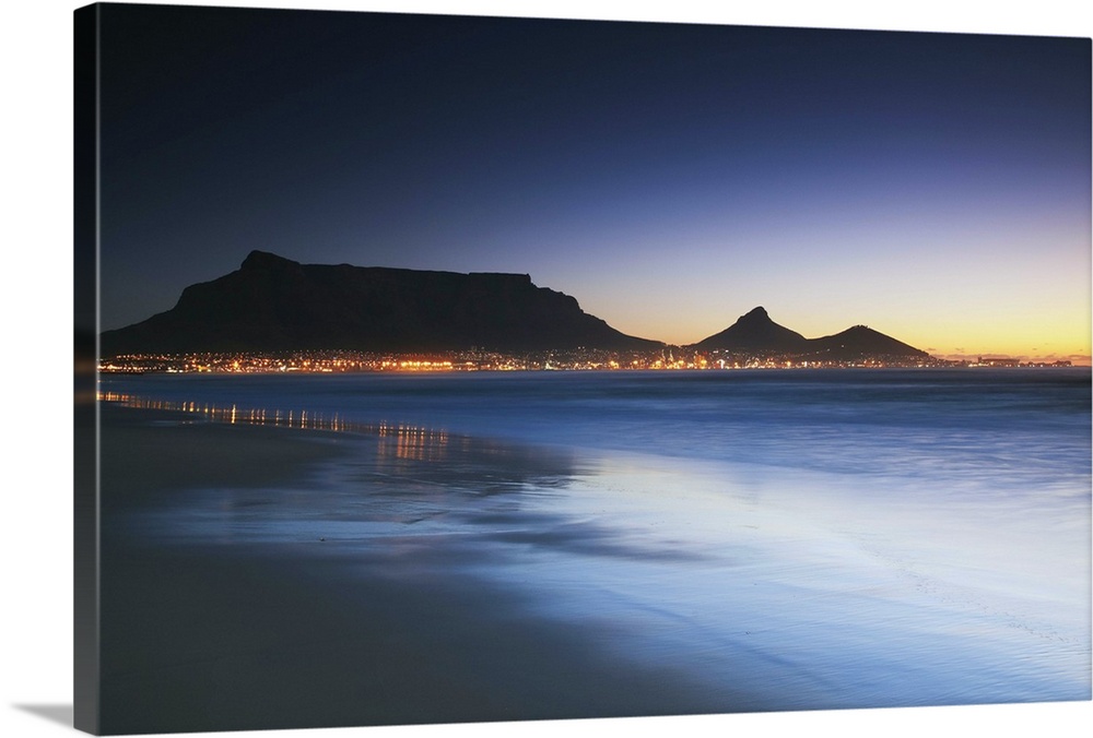 View of Table Mountain at dusk from Milnerton beach, Cape Town, Western Cape, South Africa