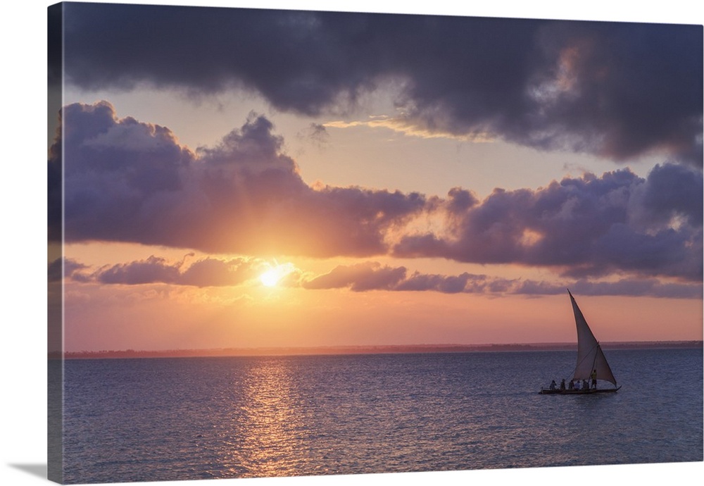 Tanzania. Zanzibar, Michamvi Village, traditional Dhows (traditional local sailboats) sailing at sunset