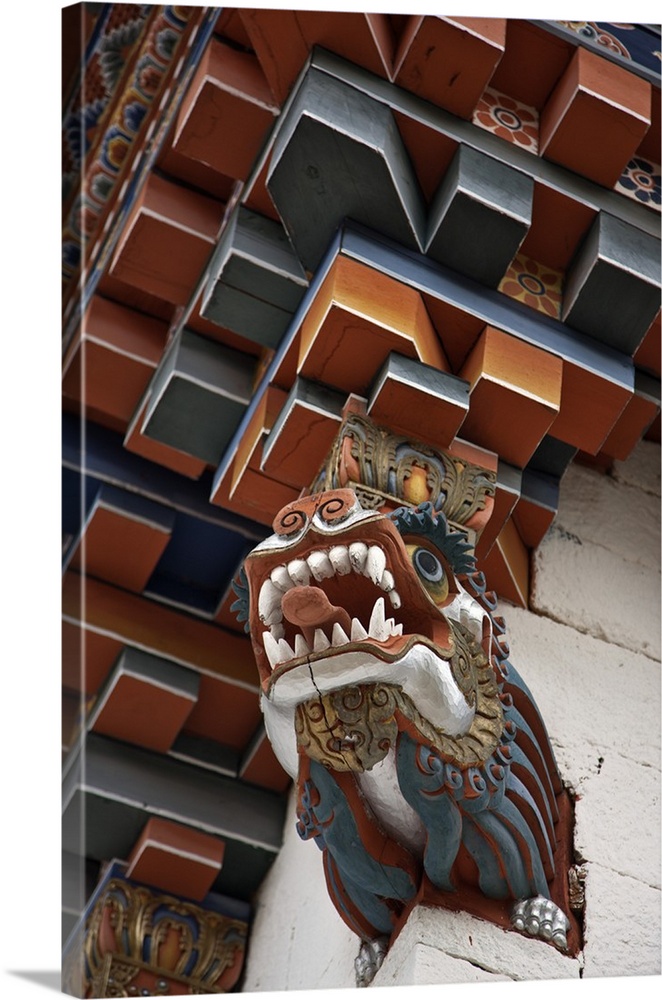 The architectural corner detail of the roof of a new temple near Kurjey Lhakhang with a carving of a dragon at its base. B...