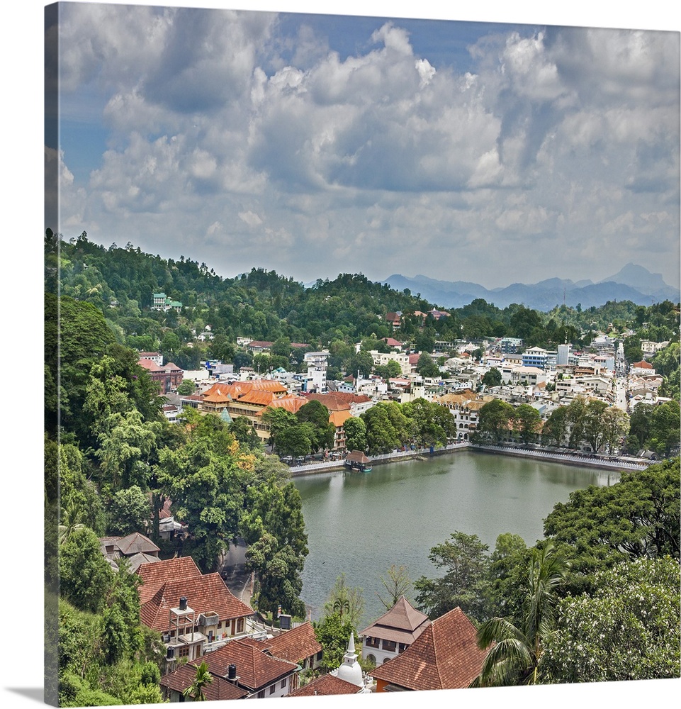 The attractive city of Kandy is built around its picturesque artificial lake and the hills beyond. It is the island's seco...