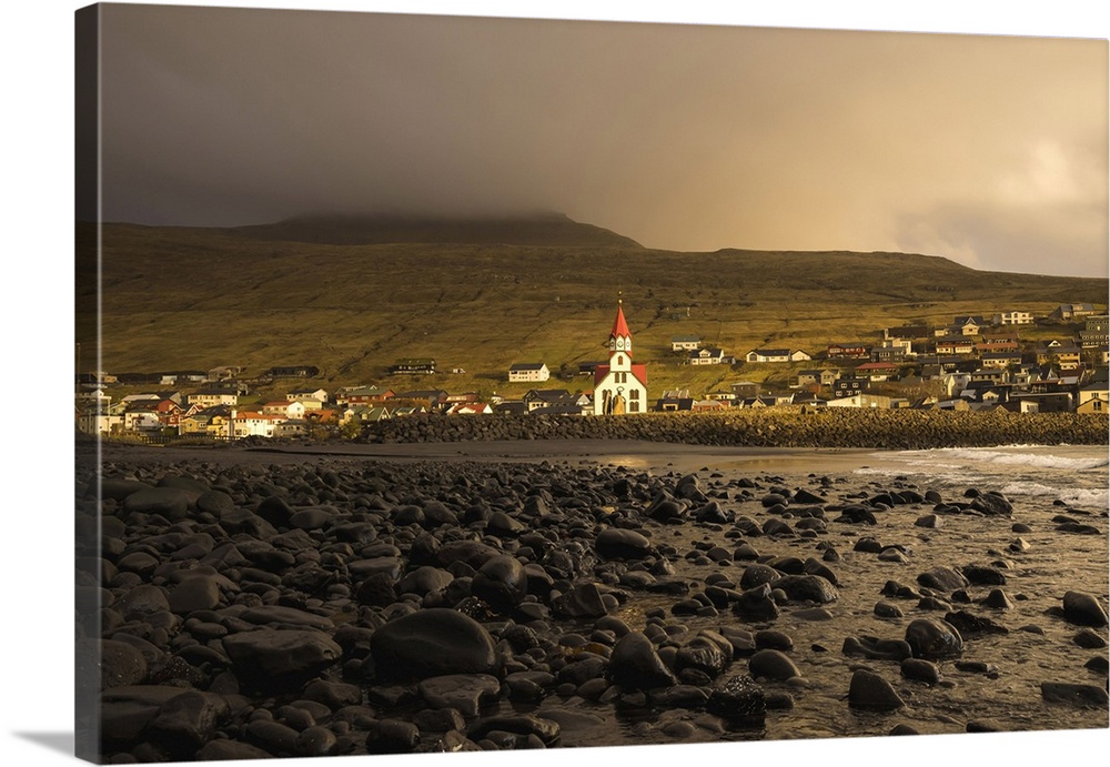 The church in the village of Sandavagur at sunset. Island of Vagar. Faroe Islands