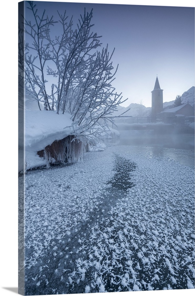 The frozen river Inn framed by mist and snow at dawn, Sils, Canton of Graubunden, Engadine, Switzerland, Europe.