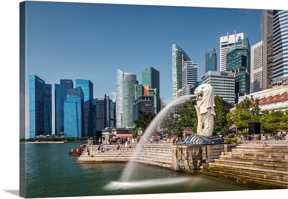 The Merlion statue with city skyline in the background, Marina Bay, Singapore.