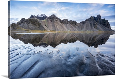 The mountains reflect on the surface of the ocean, Stokksnes, Eastern Iceland