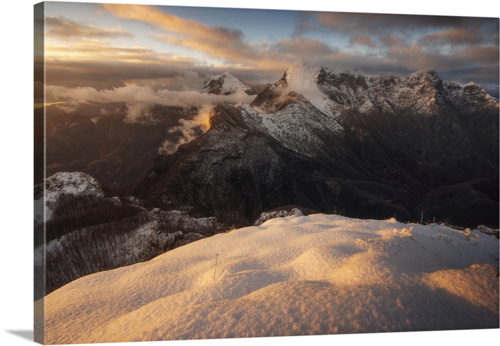 The Pania della Croce and Pania Secca seen from the Monte Croce during a winter sunset in the Apuan Alps, Tuscany.