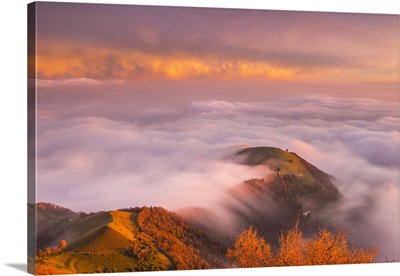 The sunset above the clouds over Prealpi Orobiche, Lombardy, Italy