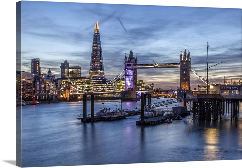 The Tower Bridge in London seen from the east at dusk. In the background on the left the Shard skyscraper, the tallest bui...