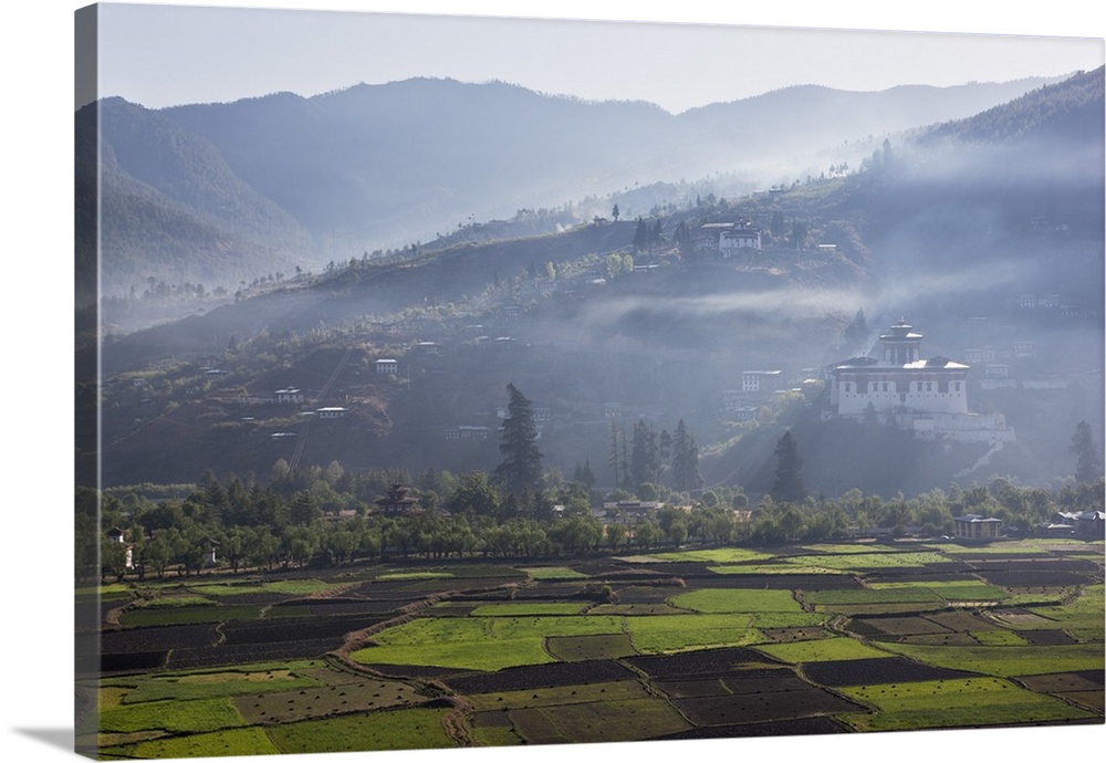 The very impressive 16th century Paro Dzong , the fortress that sits on a heap of Jewels, and its round watchtower, now a ...