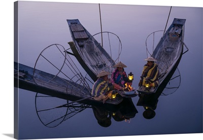Three Fishermen Sitting On Their Boats Around A Fire, Lake Inle, Myanmar