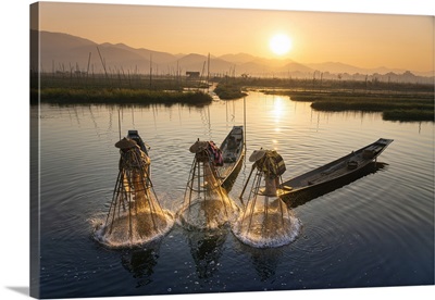 Three Fishermen Using Traditional Conical Nets At Sunrise, Myanmar