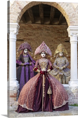 Three Women Wearing Indian Style Costumes And Masks, Venice, Italy