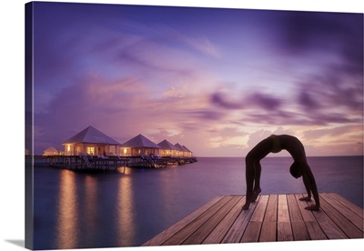 Thudufushi Island, Diamonds Thudufushi Resort, man practising Yoga at sunset