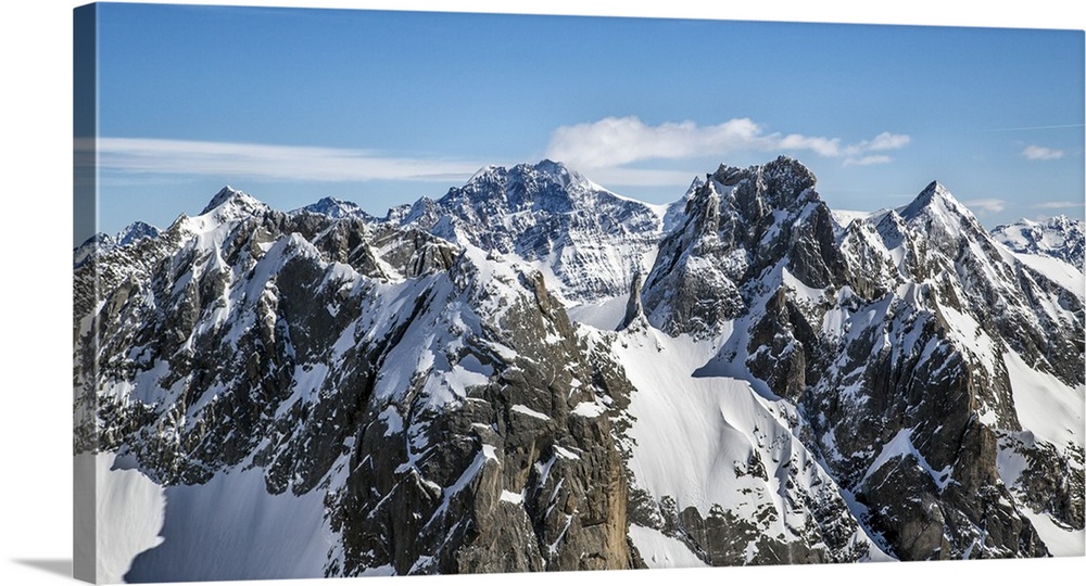 Aerial view of Torrone Peak in winter with Bernina Peak in the background. Valmasino. Lombardy. Italy.