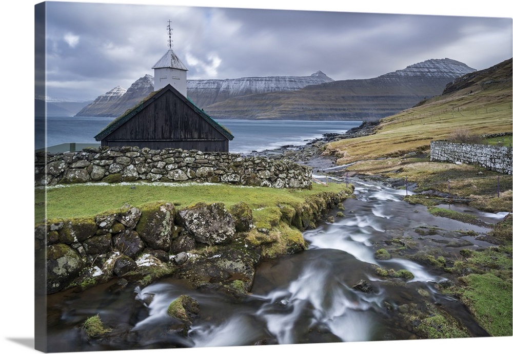 Traditional Faroese wooden turf roofed church in the village of Funningur on the island of Eysturoy, Faroe Islands, Denmar...
