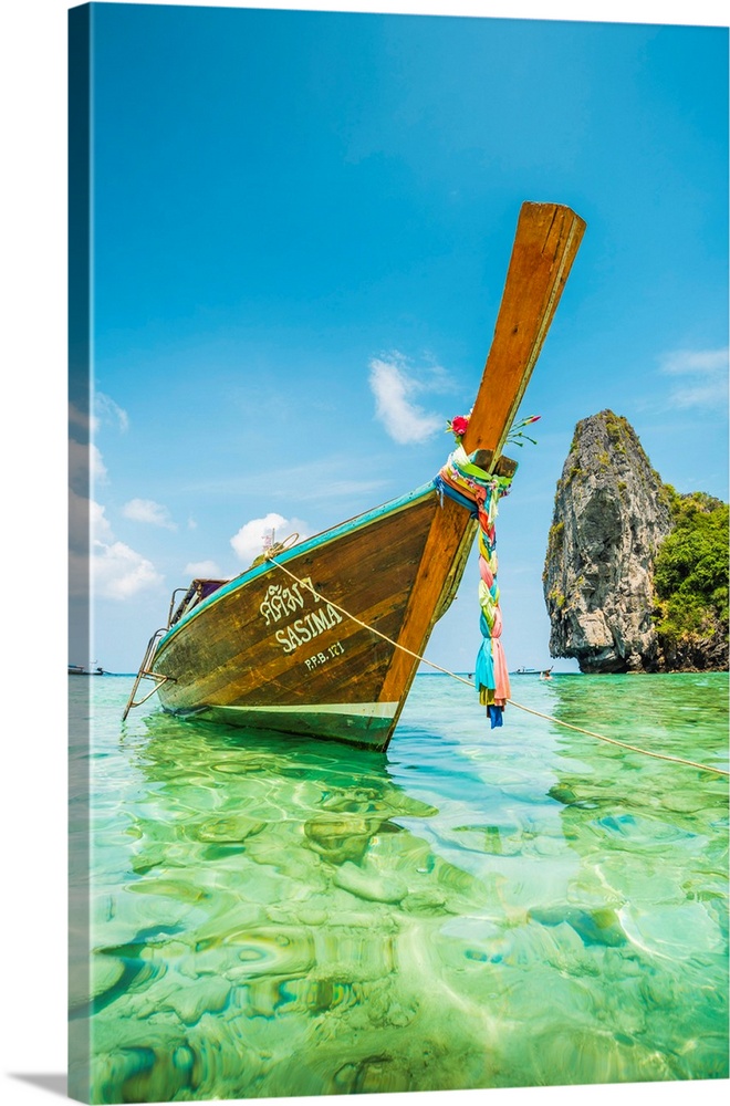 Ao Nui (Nui Beach), Ko Phi Phi Don, Krabi Province, Thailand. Traditional Long Tail Boat Moored On Turquoise Waters.
