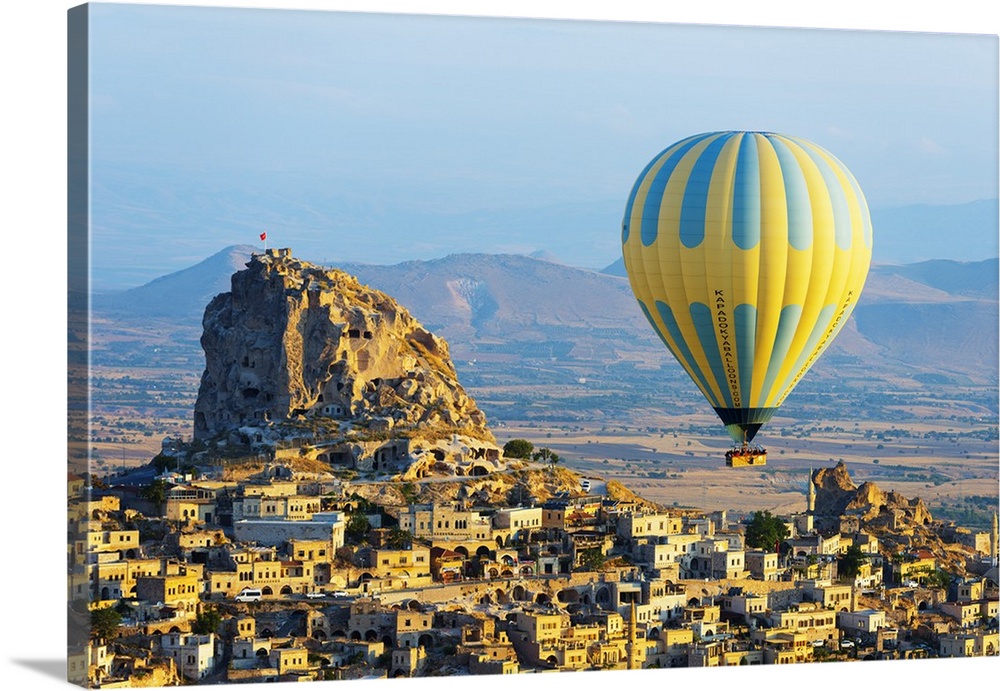 Turkey, Central Anatolia, Cappadocia, balloon flight over Uchisar Castle near Goreme, UNESCO World Heritage site.