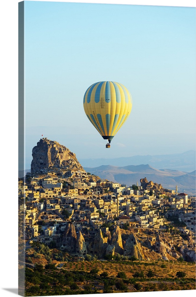 Turkey, Central Anatolia, Cappadocia, balloon flight over Uchisar Castle near Goreme, UNESCO World Heritage site.