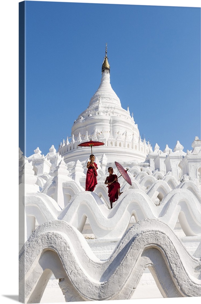 Two Buddhist novice monks on the white pagoda of Hsinbyume (Myatheindan) paya temple, Mingun, Sagaing region, Myanmar