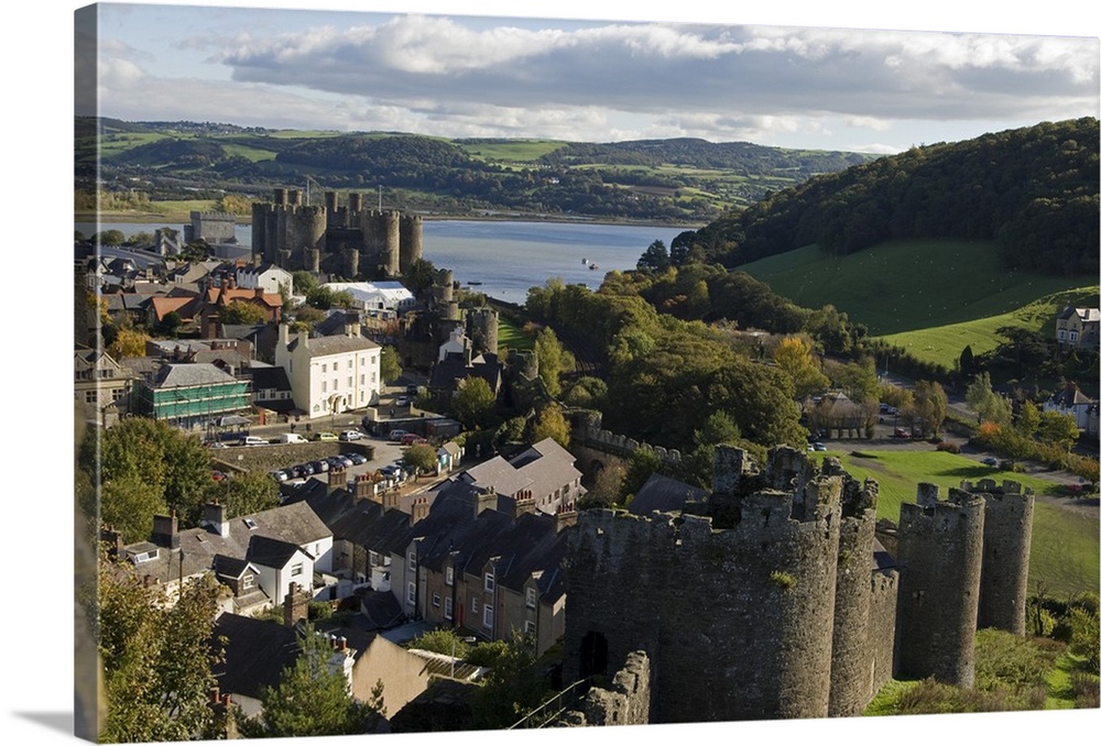 UK, North Wales, Conwy. View of the town and castle with the Conwy River behind.