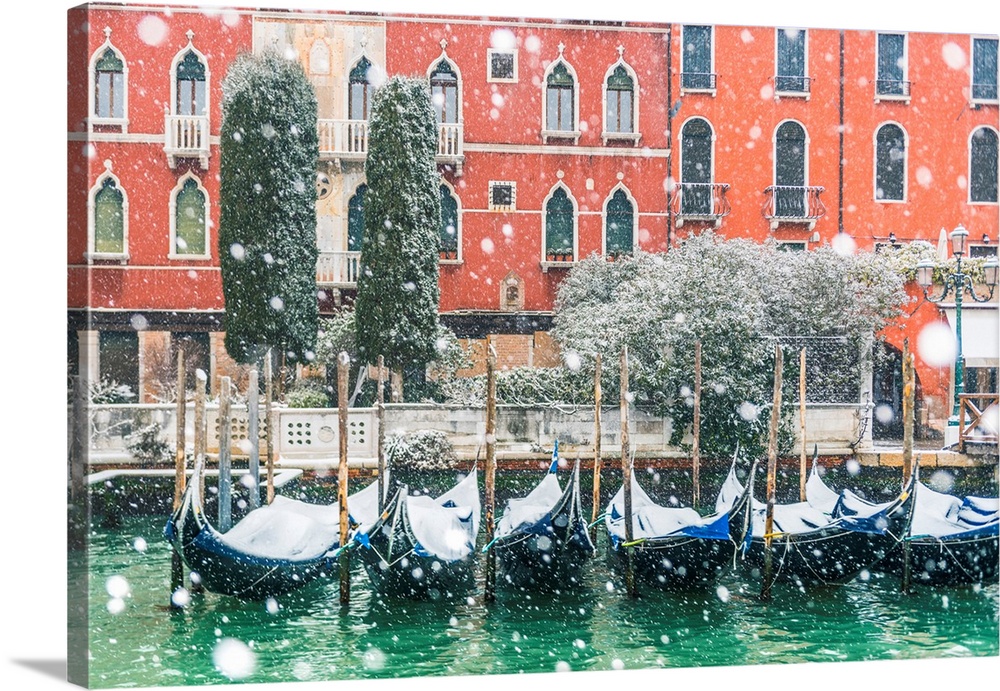 Venice, Veneto, Italy. Snowfall Over Moored Gondolas Along The Grand Canal (Canal Grande).