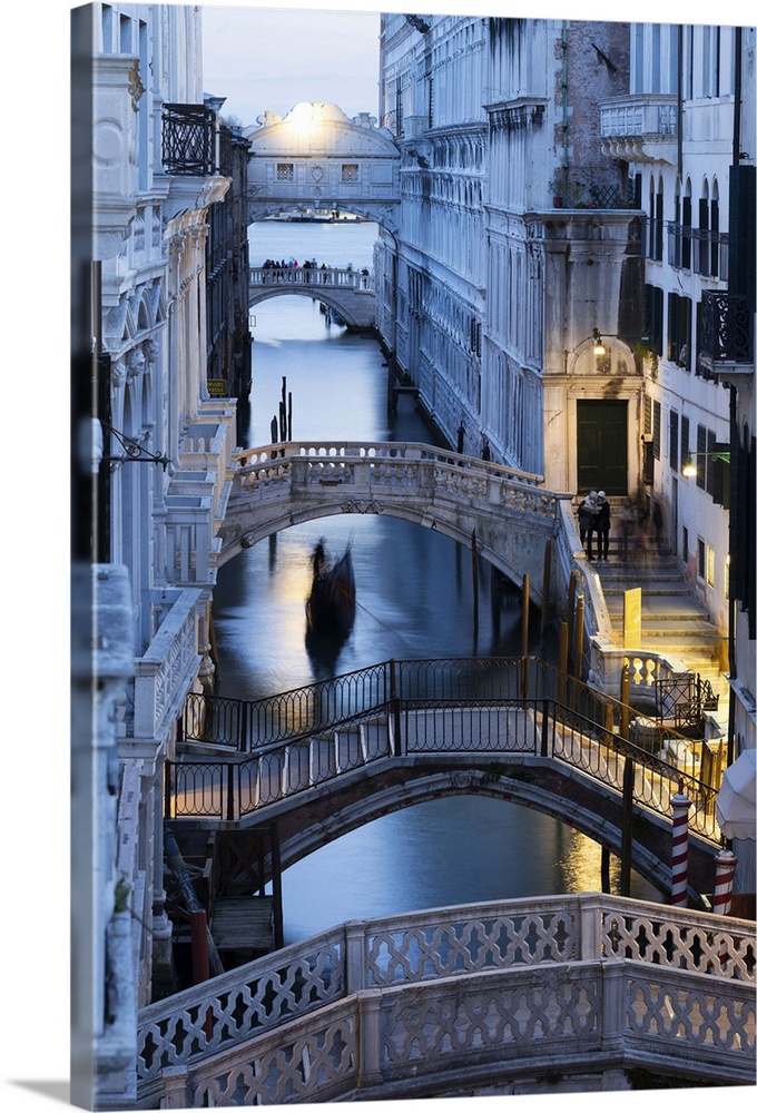 Venice, Veneto, Italy. Bridges over a canal with Bridge of Sights in the background.
