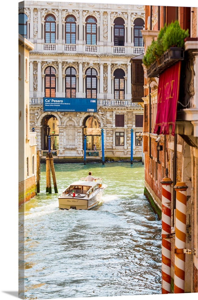 Venice, Veneto, Italy. Buildings and boats in the canals. Ca' Pesaro Palace.