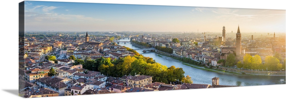 Verona, Veneto, Italy. High angle panoramic view of the old town and the Adige river at sunset.
