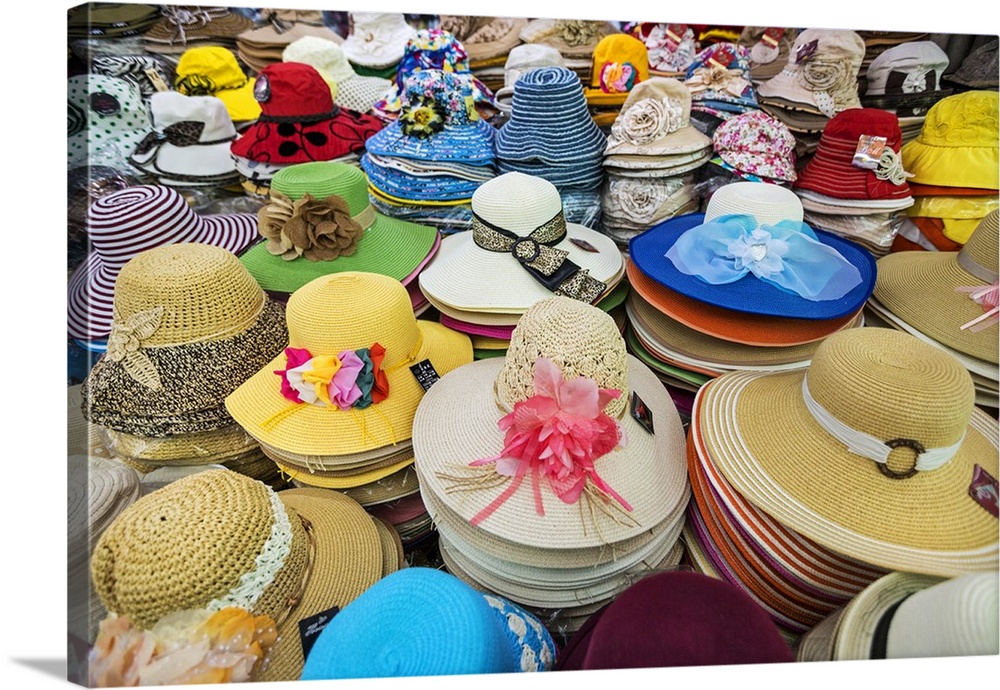 Vietnam, Ho Chi Minh Province, Ho Chi Minh City, Saigon. Hats galore! A stall in Saigon market.