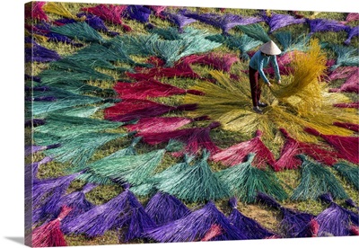 Vietnam, Phu Yen Province,  A Woman Lays Out Traditional Reed Mats To Dry