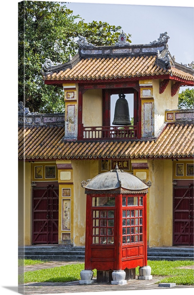 Vietnam, Thura Thien-Hue Province, Hue. The bell tower of the Hiem Lam Pavilion and a classic red wood and glass telephone...